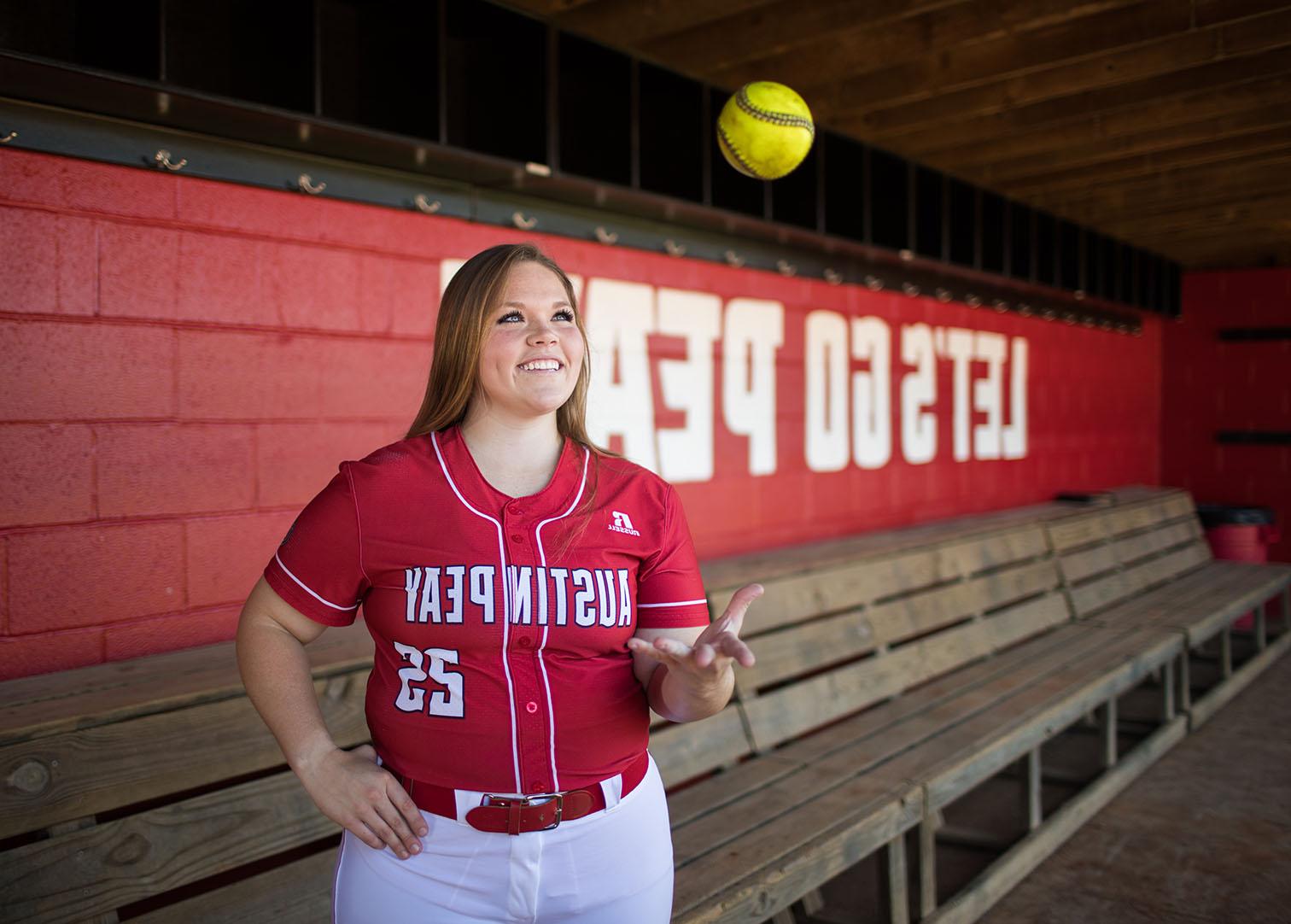 Alexis Hill poses on softball field